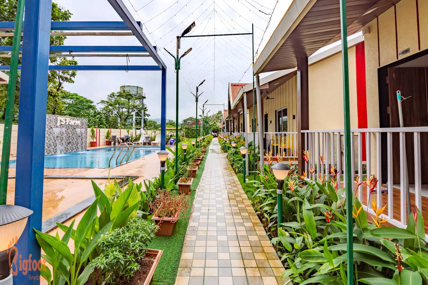 Garden seating on the lawn at JS Farm Resort, Karjat