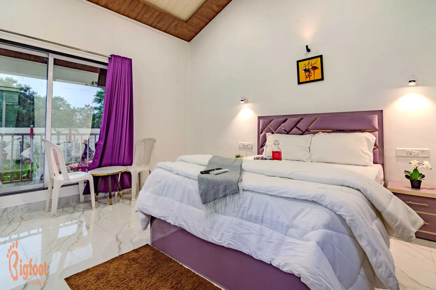 Deluxe Room with queen bed and garden-facing window at JS Farm Resort, Karjat
