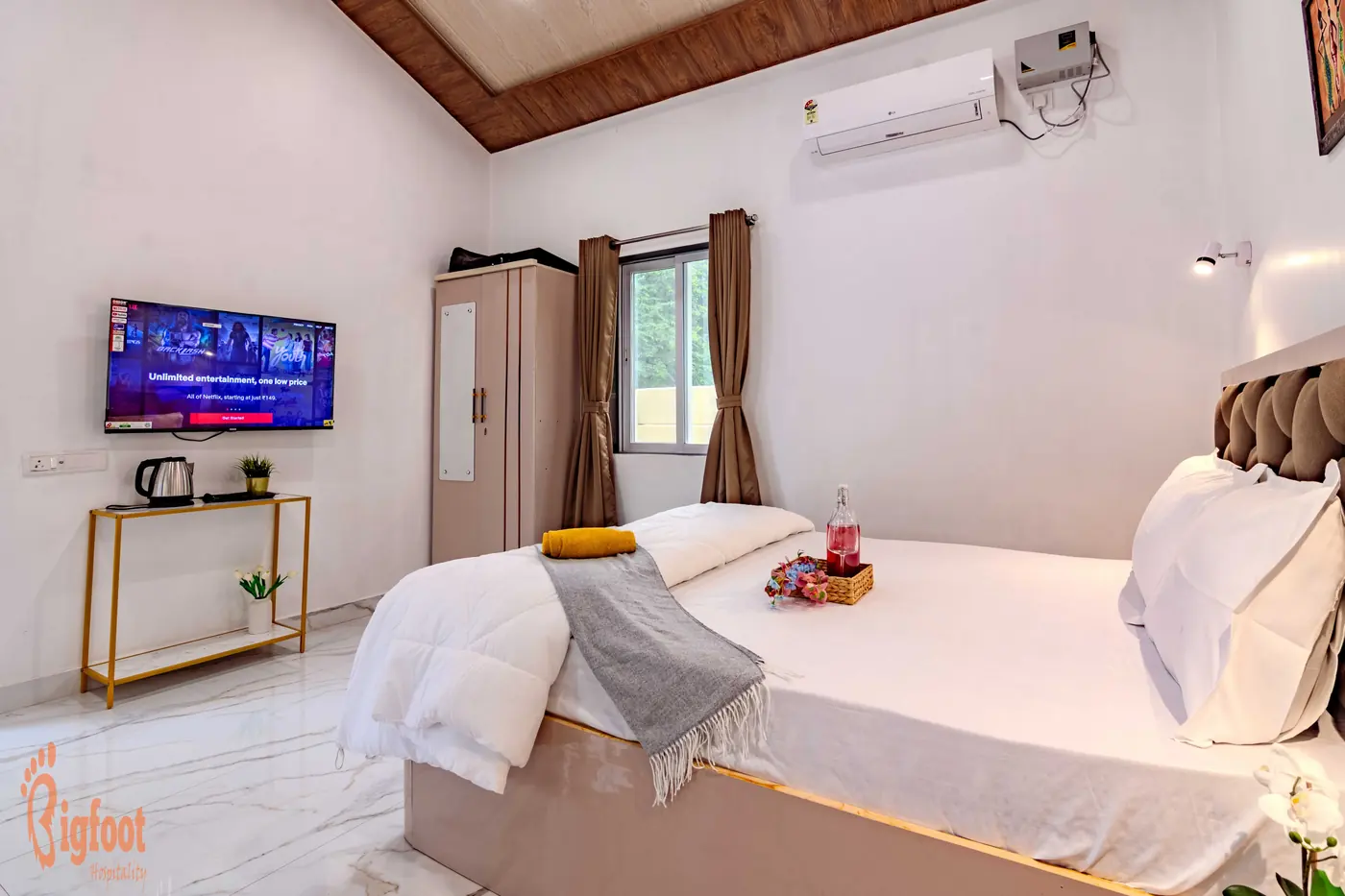 Private sit-out area outside a Deluxe Room at JS Farm Resort, Karjat