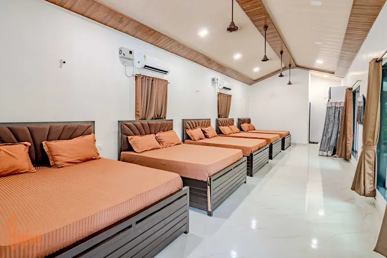 Dormitory room with five queen beds at JS Farm Resort, Karjat